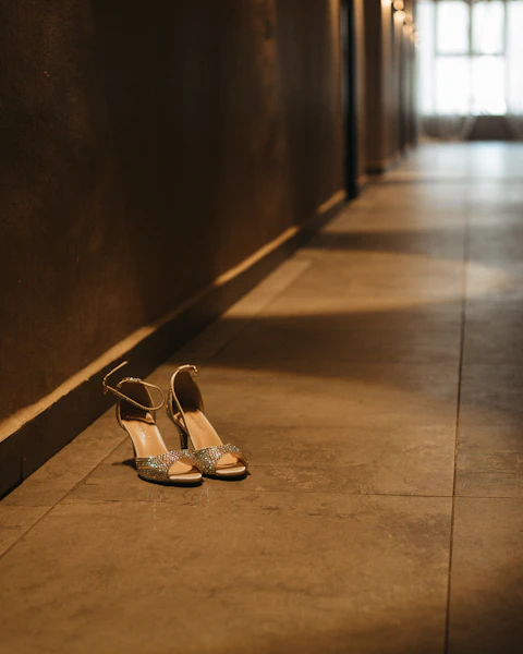 Strappy heels kicked off in a sunlit hotel corridor: overnight escort in London